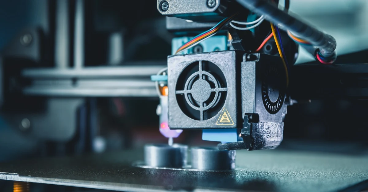 3D printer producing an engine block model